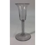 An 18th century glass, long bell bowl, double series opaque twist stem, conical foot and rough