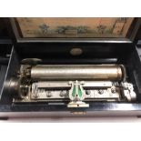 A 19th century Swiss cylinder music box, the 28 cm cylinder playing eight airs with arrow