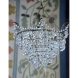 A vintage gilt framed crystal strung electrolier of graduated tiers, to/w a gilt metal ribbon bow