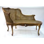 A Louis XV style giltwood framed bergere salon sofa, 140 cm long x 93 cm h o/a (the seat 44 cm h),