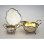 A Victorian silver card salver in the form of a Regency tea pot stand with beaded rim, London 1893