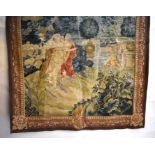 A hand-stitched wool tapestry wall hanging featuring a couple in a garden setting beside a