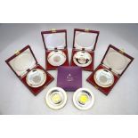 Four cased silver pin-dishes, set with commemorative crowns (cupro-nickel) to/w two boxed Aspreys