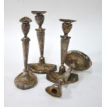 A set of four electroplated candlesticks of elliptical baluster form with fluted stems, 28 cm high