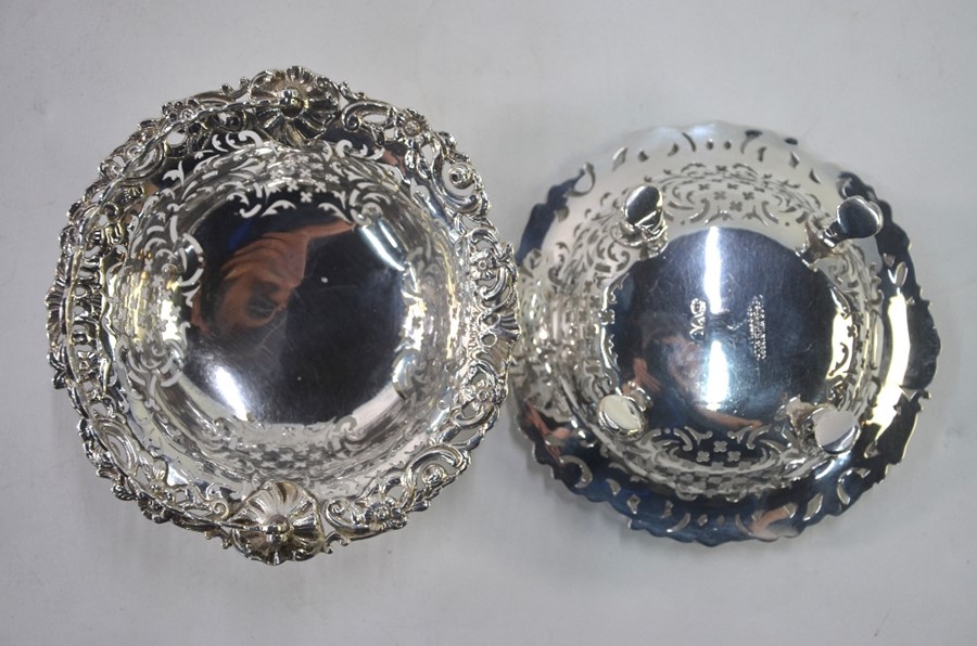 A pair of late Victorian pierced silver bonbon baskets with guilloche swing handles, on lion-mask - Image 3 of 3