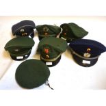 Seven vintage German police hats to include a beret comprising - Railway Police, Bremen, Bavaria,