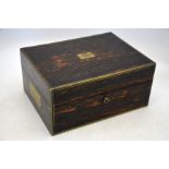 A Victorian brass-bound coromandel travelling toilet-case, the blue velvet and Morocco leather