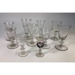 A collection of ten 19th century drinking glasses, all with rough pontils, 7 - 13 cm high (9)The one