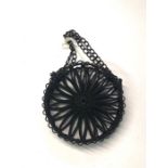 A 19th century Berlin-work coin purse, the circular wheel design sides with coiled wire spokes and