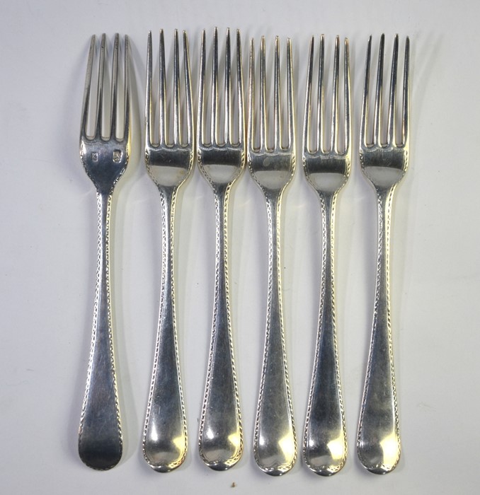 A set of six George III silver bright-cut table forks, assay and maker's marks only, probably George