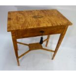 A Regency satinwood side table, the top centred by an inlaid shell motif over a single drawer,