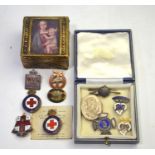Three silver and enamel badges, a white metal locket and a small collection of base metal