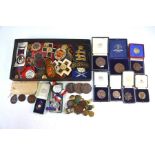 An interesting collection of mostly inter-war prize medallions and embroidered badges from rifle