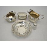 Two small Victorian silver cream jugs, Birmingham 1883/89 to/w a small cut glass scent bottle and