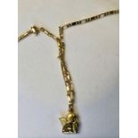An Italian yellow metal figaro chain stamped 750 with angel pendant attached, approx 8.7g