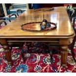 A mid 19th century mahogany extending dining table, the moulded top with rounded corner with four