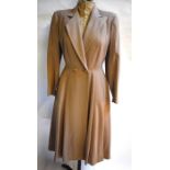 A 1940s oatmeal wool crepe lady's coat with fitted bodice and pleat to back, 47 cm across