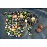Various marbles and two iron balls of shot etc