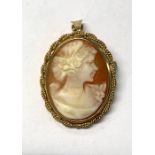 An oval shell cameo featuring young lady with ornate hair in profile, within 9ct yellow gold rope