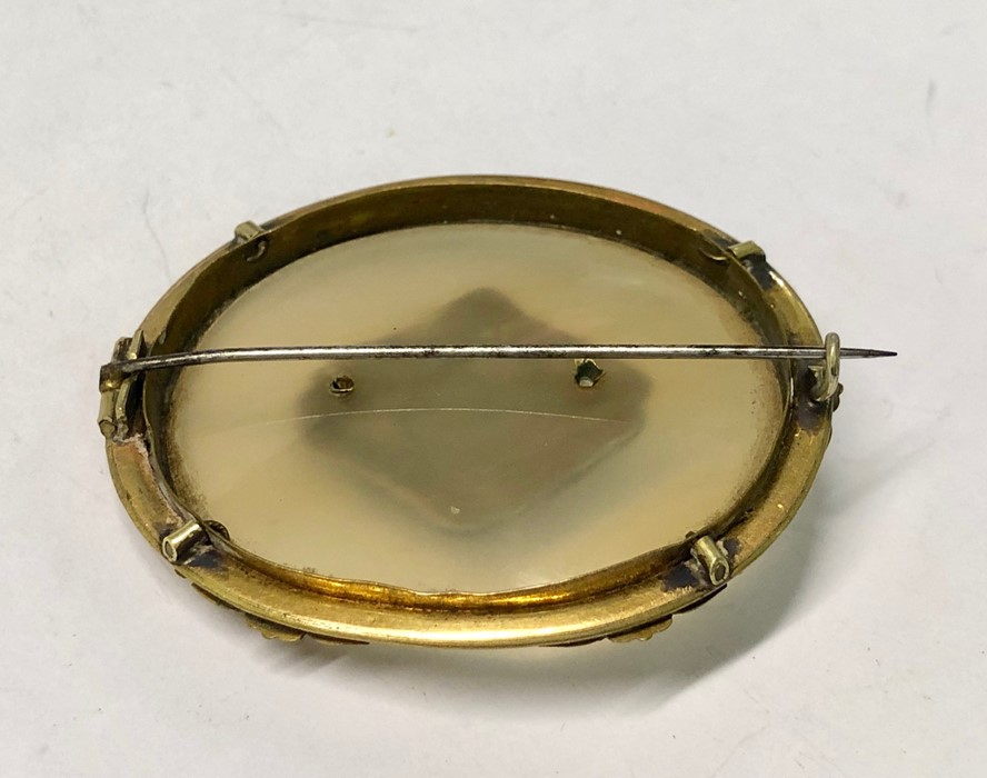 A large Victorain oval chalcedony brooch with gilt metal scroll mount and small oval cameo and - Image 2 of 5