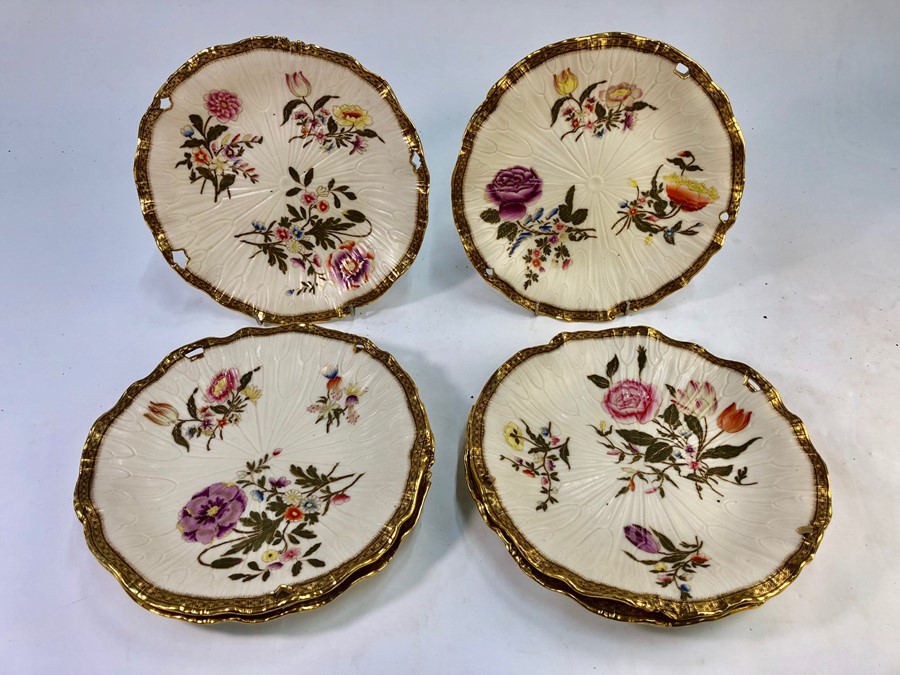 Six Victorian Royal Worcester cream ground cabinet plates, moulded open flower shape, each painted