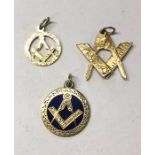 Three 9ct yellow gold Masonic pendants featuring square and compasses, one with blue enamel