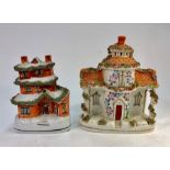 Two 19th century Staffordshire cottages, one a money box, 17 cm high, the other 21 cm high (2)The