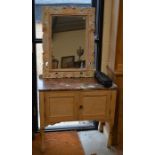 A small marble top wash stand with panelled cupboard doors to/w a rectangular wall mirror in