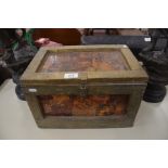 A decoupage and gilt painted small chest containing shoe cleaning items