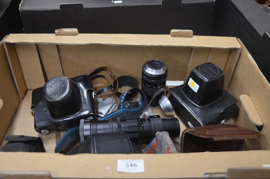 A box of assorted cameras to include Praktica, Zenit, a Movikon 8 cine camera, various lens and