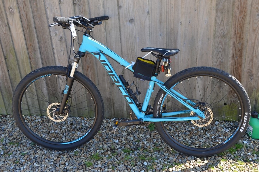 A Norco storm hardtail mountain bike with 15 inch turquoise frame c/w a Cateye Velo wireless