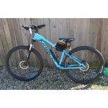 A Norco storm hardtail mountain bike with 15 inch turquoise frame c/w a Cateye Velo wireless