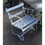 A pair of white painted wrought metal and teak garden armchairs