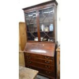 A 19th century mahogany crossbanded and inlaid bureau bookcase, the pair of astragal glazed doors