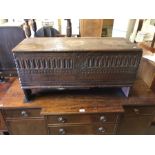 An early English oak six plank coffer, the front with carved decoration (some later alterations)