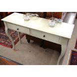 A Laura Ashley white painted console table with two frieze drawer, raised on shaped supports