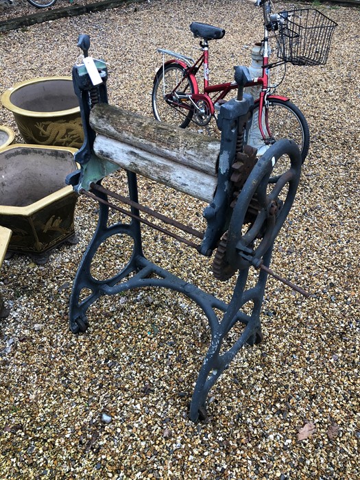 An antique cast iron framed 'Globe' brand twin wooden roller mangle, weathered