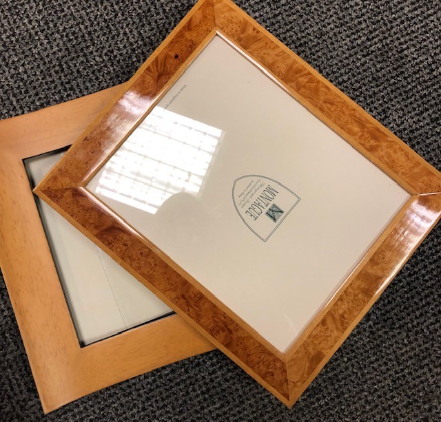 A box of various photograph frames, various sizes and styles