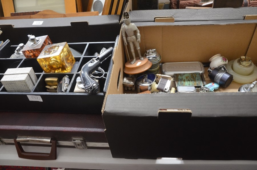 Two boxes containing a large collection of novelty and other vintage table and cigarette lighters