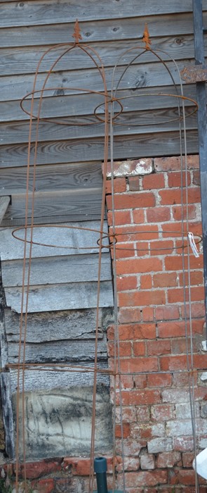 A pair of large arrowhead garden obelisks