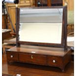 A Victorian mahogany framed toilet mirror with turned ivory finials and three drawer platform base
