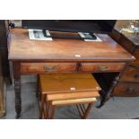 An Edwardian mahogany hall table with two frieze drawers, raised on turned supports with castors