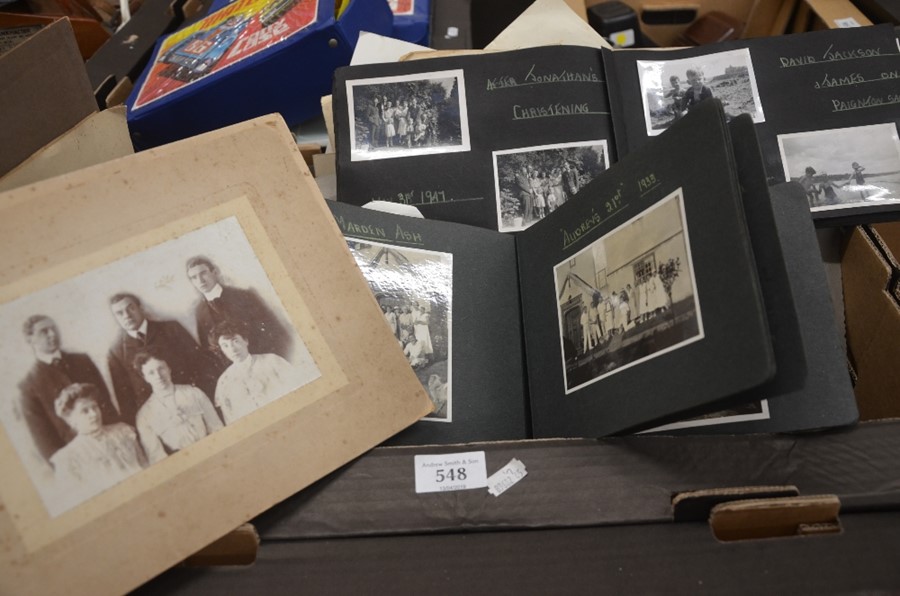 A box containing numerous Victorian and later photographs, loose and in albums