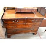 A small mahogany chest of two short over two long drawers raised on bracket feet (A/F)