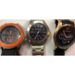 Three gent's fashion watches bearing makers names for Ben Sherman, Emporio Armani and Boss Orange,