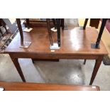 A 19th century mahogany side table with opposing end drawers, raised on tapering square supports