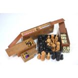 A boxed set of bone and ebony dominoes, to/w two sets of carved wood chessmen, kings measure 9 cm