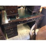 A Victorian style twin pedestal desk