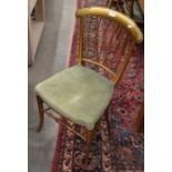 A set of four Thonet style gilt painted dining chairs with green dralon upholstery