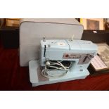 A vintage electric Singer sewing machine in case, Model No.348 [BP53]